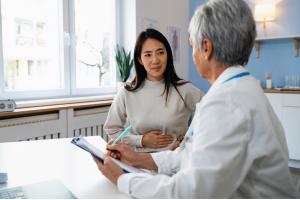 Man sitting on the toilet experiencing chronic diarrhea