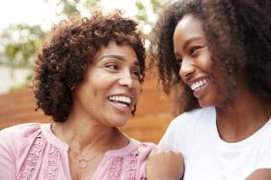 Two women smiling after discussing women's health