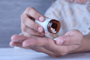 Person taking antibiotics for strep throat